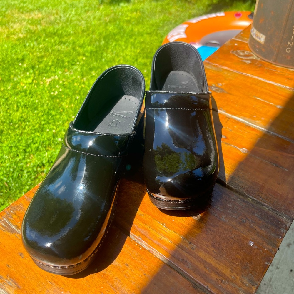 Dansko pro clogs mostly good condition-some wear on the top band on both shoes